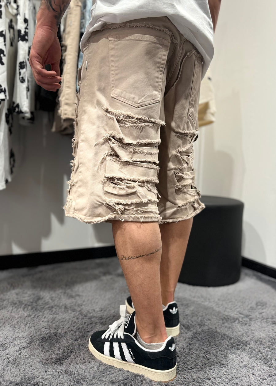 Shorts con strappi beige